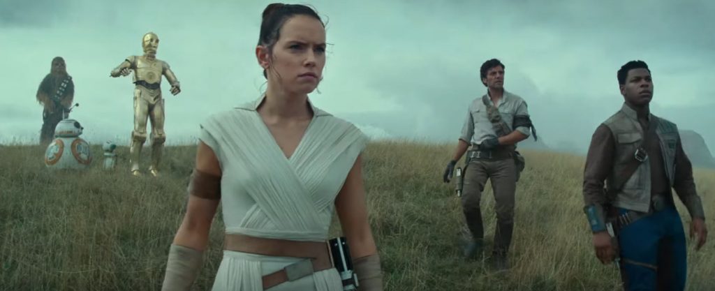 Rey, Finn, Poe and friends look on at the wreckage of an old enemy 